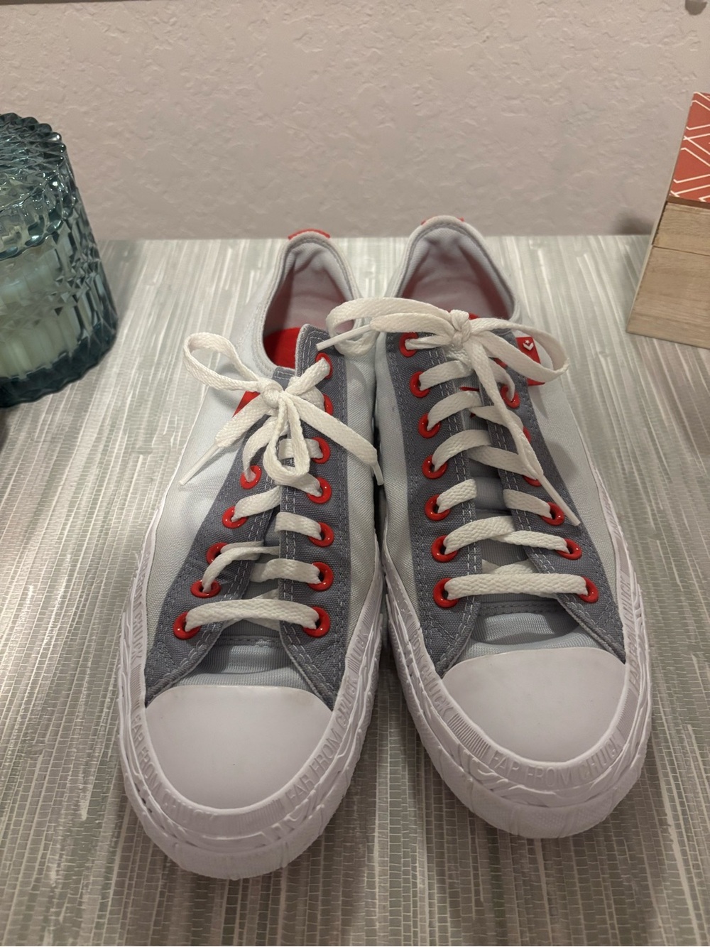 Converse Low Top Sneakers in Gray, White & Red Eyelets